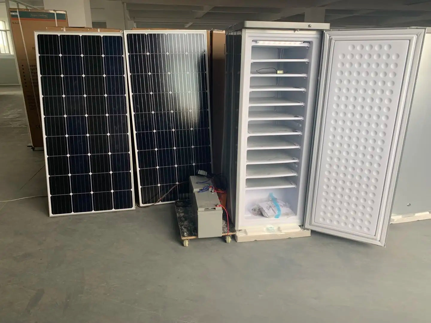 190-litre upright DC freezer with batteries and solar panels